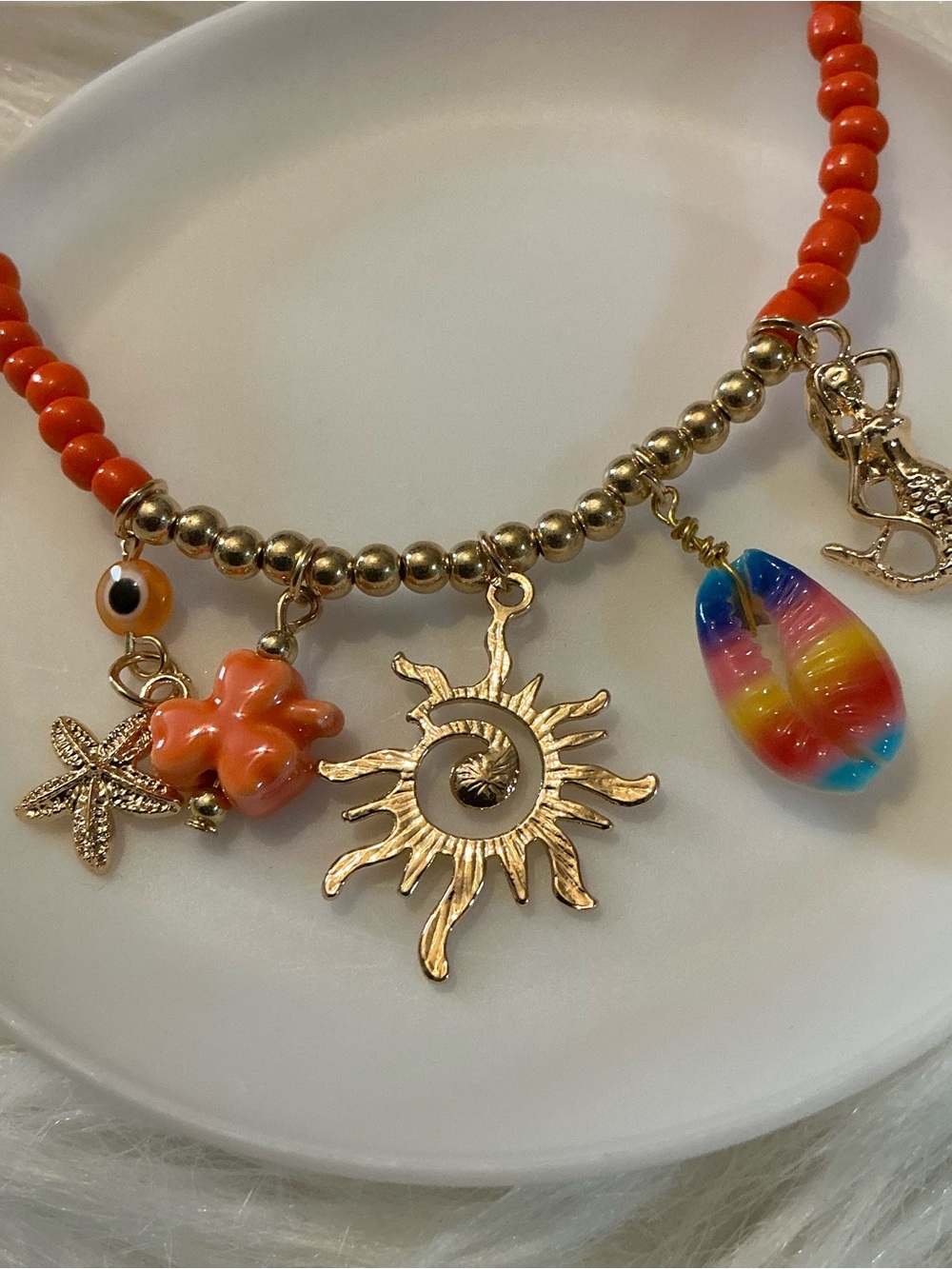 Orange and gold-tone vibrant summer beach/ocean charm high collar necklace